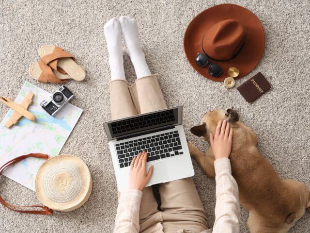 Pug and owner making international travel plans.